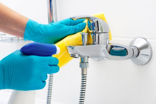 Cleaner working in a Bromley flat with practical access